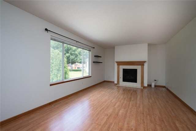 6514 Fox Run Dr SW, Cedar Rapids, IA 52404 - unfurnished living room featuring light wood-style flooring and a fireplace