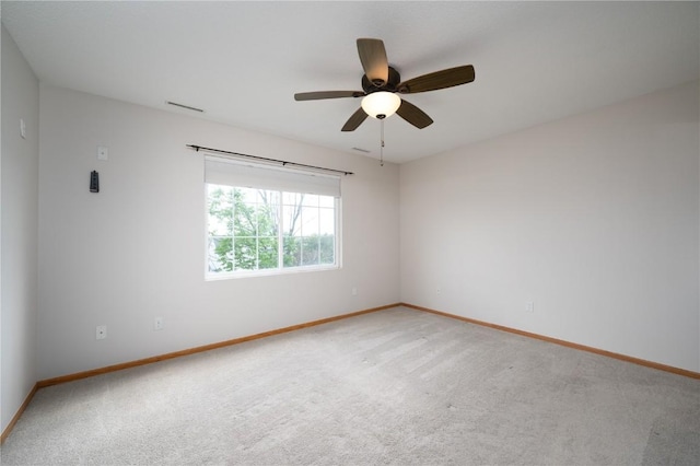 6514 Fox Run Dr SW, Cedar Rapids, IA 52404 - empty room featuring light carpet and a ceiling fan