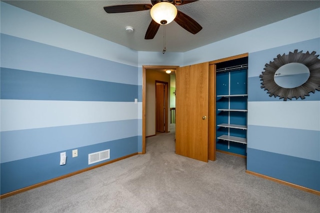 6514 Fox Run Dr SW, Cedar Rapids, IA 52404 - unfurnished bedroom featuring carpet flooring, a closet, and a ceiling fan