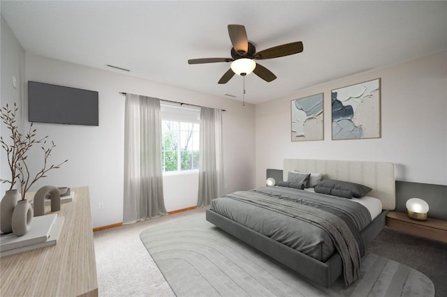 6514 Fox Run Dr SW, Cedar Rapids, IA 52404 - carpeted bedroom featuring baseboards and a ceiling fan