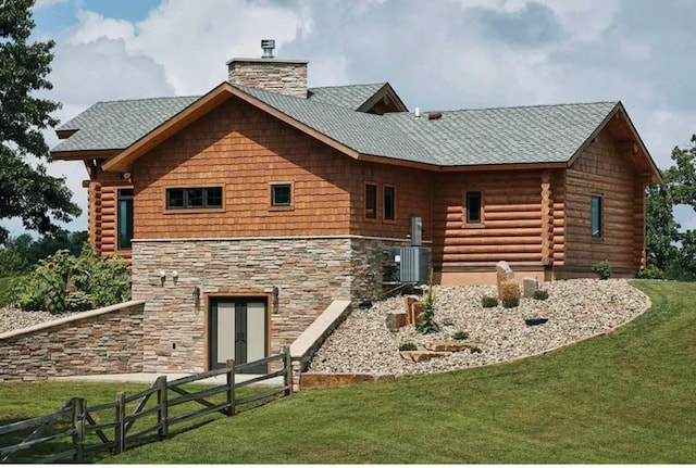 140 Falcon Dr, Montezuma, IA 50171 - back of property with a chimney, french doors, stone siding, and log siding