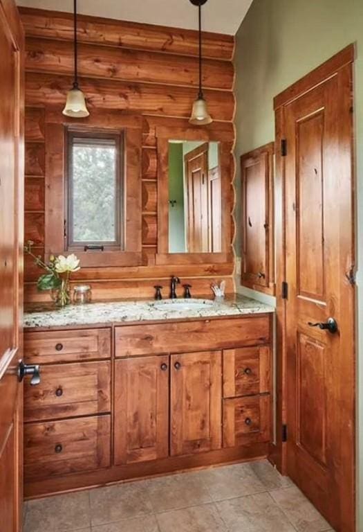 140 Falcon Dr, Montezuma, IA 50171 - bathroom with vanity and log walls