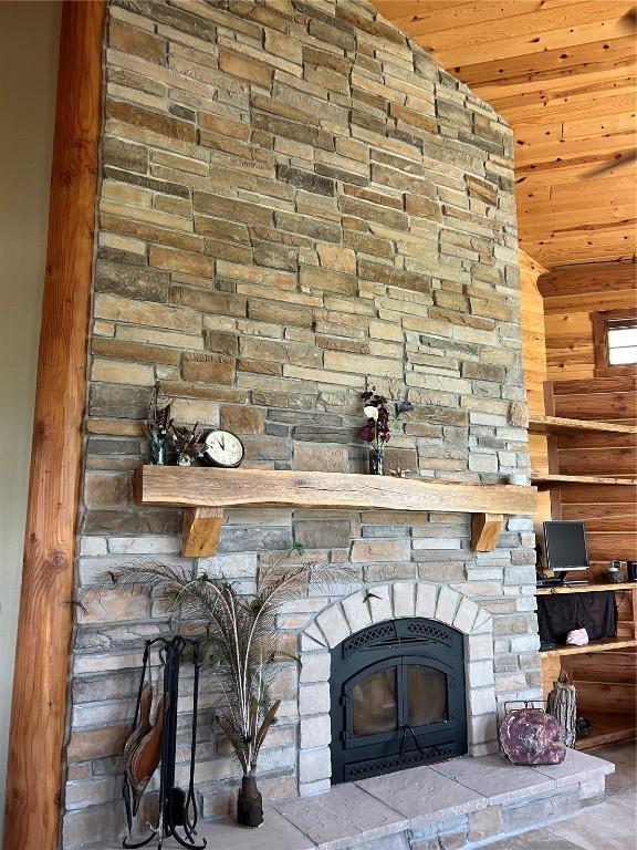 140 Falcon Dr, Montezuma, IA 50171 - detailed view of a fireplace, wood ceiling, and wooden walls
