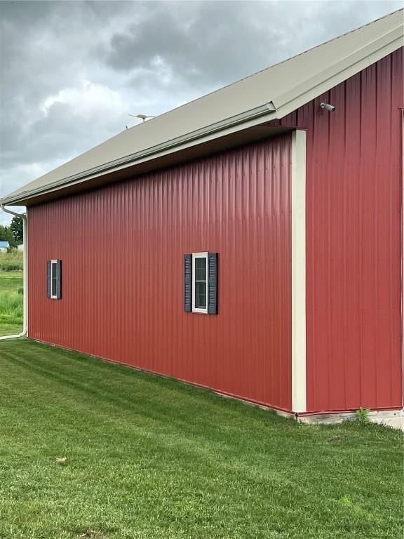 140 Falcon Dr, Montezuma, IA 50171 - view of property exterior featuring a pole building, an outdoor structure, and a lawn