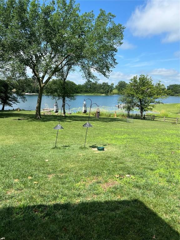 140 Falcon Dr, Montezuma, IA 50171 - view of property's community featuring a lawn and a water view