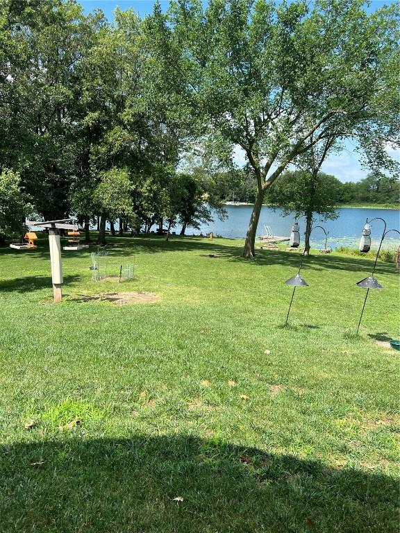 140 Falcon Dr, Montezuma, IA 50171 - view of community featuring a water view and a yard