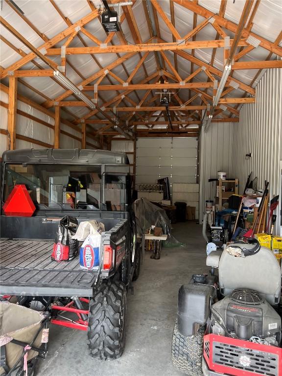 140 Falcon Dr, Montezuma, IA 50171 - garage featuring metal wall and a garage door opener
