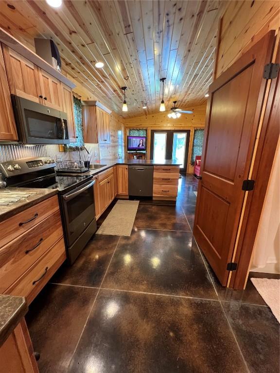 140 Falcon Dr, Montezuma, IA 50171 - kitchen featuring stainless steel appliances, a peninsula, dark countertops, concrete floors, and wood ceiling