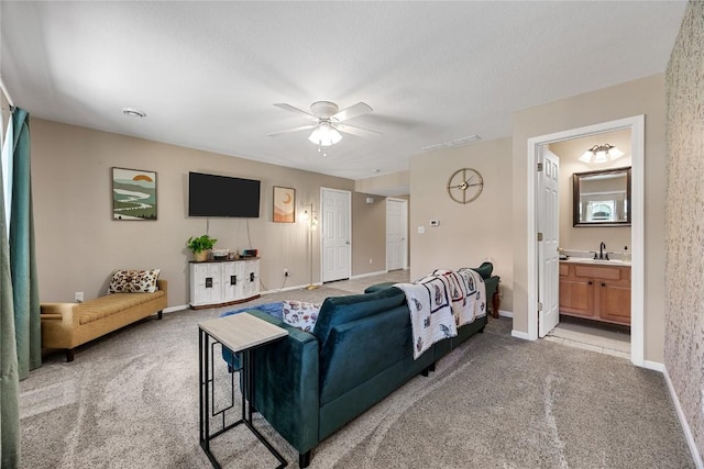 114 Therese Ave, Anamosa, IA 52205 - living room featuring light carpet and a ceiling fan