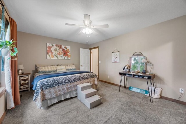 114 Therese Ave, Anamosa, IA 52205 - carpeted bedroom with baseboards and a ceiling fan