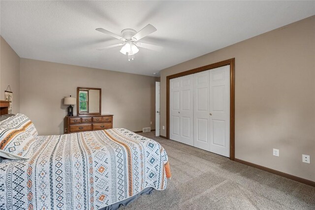 114 Therese Ave, Anamosa, IA 52205 - bedroom with carpet, a closet, and ceiling fan
