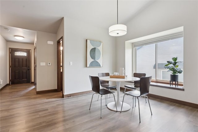 713 Hillside Dr, Tiffin, IA 52340 - dining area featuring light wood-type flooring and baseboards