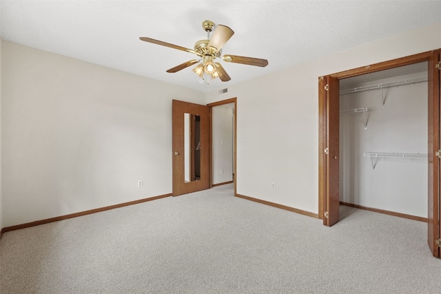 3120 Wilson Ave SW Unit 2, Cedar Rapids, IA 52404 - unfurnished bedroom featuring a closet, carpet, and ceiling fan