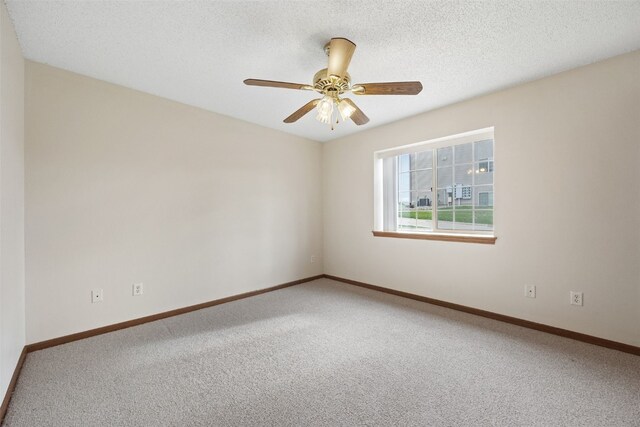 3120 Wilson Ave SW Unit 2, Cedar Rapids, IA 52404 - unfurnished room featuring carpet floors, a ceiling fan, and a textured ceiling