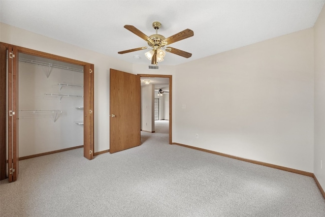3120 Wilson Ave SW Unit 2, Cedar Rapids, IA 52404 - unfurnished bedroom with light carpet, a closet, and ceiling fan