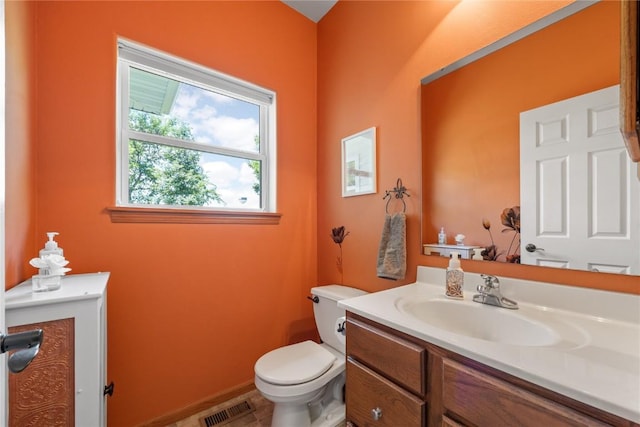 712 Willow Ct, Solon, IA 52333 - bathroom featuring toilet and vanity