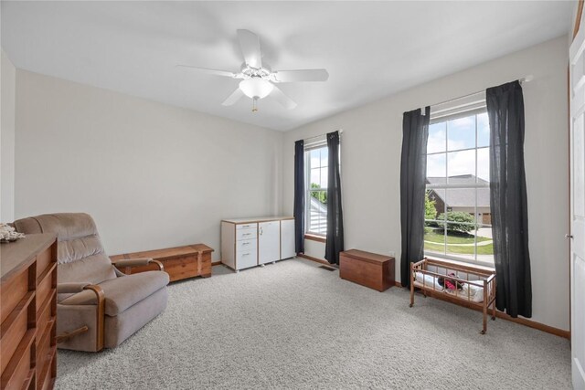712 Willow Ct, Solon, IA 52333 - living area featuring carpet and ceiling fan