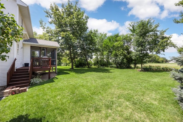 712 Willow Ct, Solon, IA 52333 - view of green lawn with stairs, a sunroom, and a wooden deck