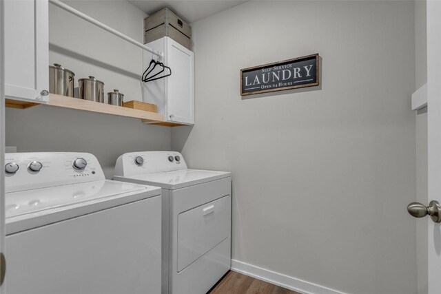 305 Sumac Dr, Palo, IA 52324 - laundry room with cabinet space, separate washer and dryer, and dark wood finished floors