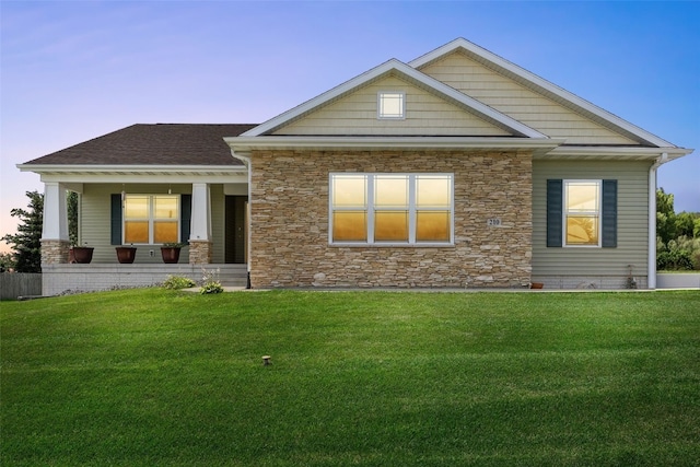 210 Northgate St NW, Shellsburg, IA 52332 - craftsman inspired home with stone siding, a lawn, and a porch
