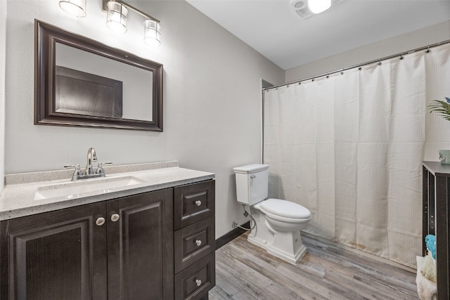 210 Northgate St NW, Shellsburg, IA 52332 - bathroom featuring wood finished floors, vanity, and curtained shower