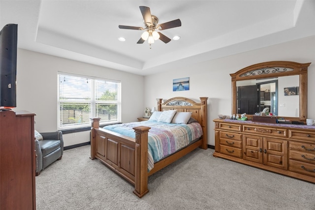 210 Northgate St NW, Shellsburg, IA 52332 - bedroom featuring a tray ceiling, light colored carpet, recessed lighting, and ceiling fan