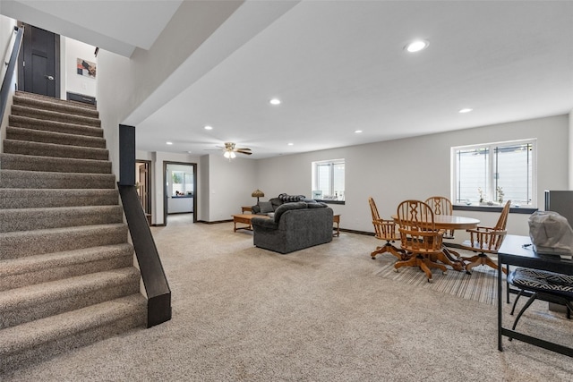 210 Northgate St NW, Shellsburg, IA 52332 - living area with light carpet, recessed lighting, stairway, and a ceiling fan