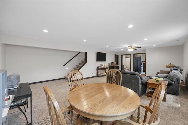 210 Northgate St NW, Shellsburg, IA 52332 - dining area with light colored carpet, stairway, ceiling fan, and recessed lighting
