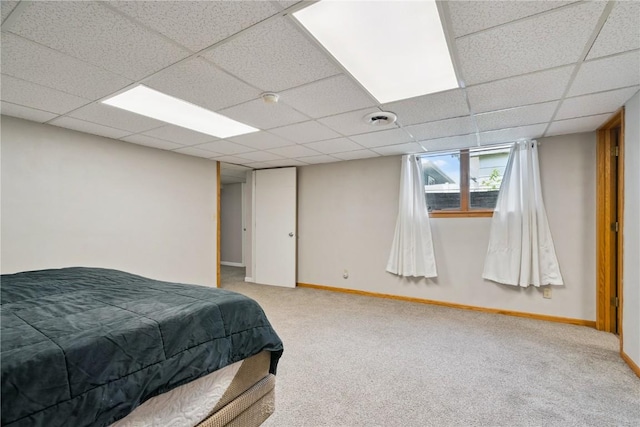 3642 Redbud Rd NE, Cedar Rapids, IA 52402 - bedroom with light carpet and a drop ceiling
