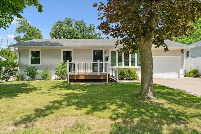 3642 Redbud Rd NE, Cedar Rapids, IA 52402 - ranch-style house featuring an attached garage, driveway, a front lawn, and roof with shingles