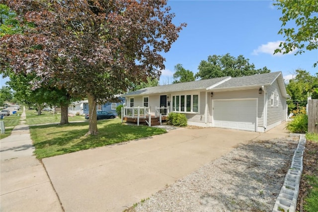 3642 Redbud Rd NE, Cedar Rapids, IA 52402 - view of front facade with an attached garage, concrete driveway, a front lawn, and a deck