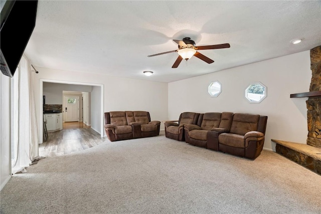 3642 Redbud Rd NE, Cedar Rapids, IA 52402 - carpeted living area with ceiling fan and baseboards