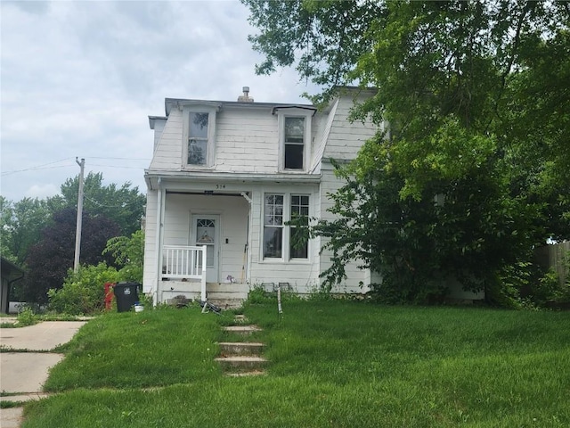 314 E Main St, Oxford, IA 52322 - view of front of home featuring a front lawn and mansard roof
