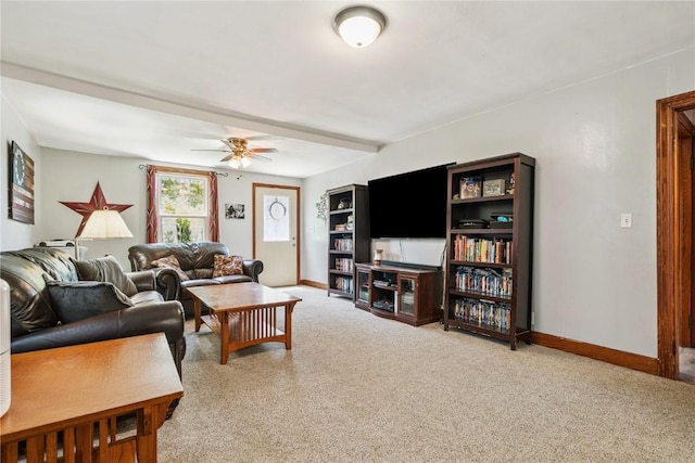 1207 E 4th St, Vinton, IA 52349 - living room with carpet floors and a ceiling fan