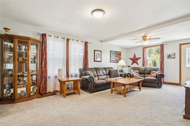1207 E 4th St, Vinton, IA 52349 - living area featuring carpet floors and a ceiling fan