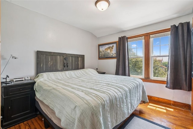 1207 E 4th St, Vinton, IA 52349 - bedroom featuring dark wood-style flooring