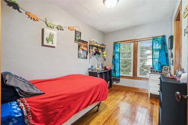 1207 E 4th St, Vinton, IA 52349 - bedroom with hardwood / wood-style flooring and baseboards