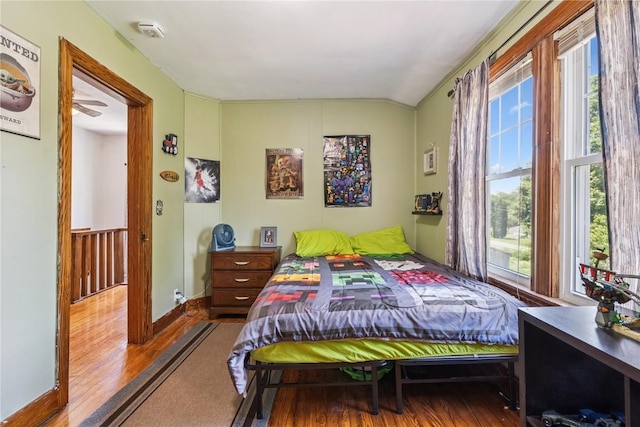 1207 E 4th St, Vinton, IA 52349 - bedroom with lofted ceiling and wood finished floors