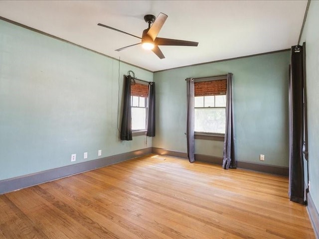 425 24th NE, Cedar Rapids, IA 52402 - empty room with a ceiling fan, light wood-style floors, and ornamental molding