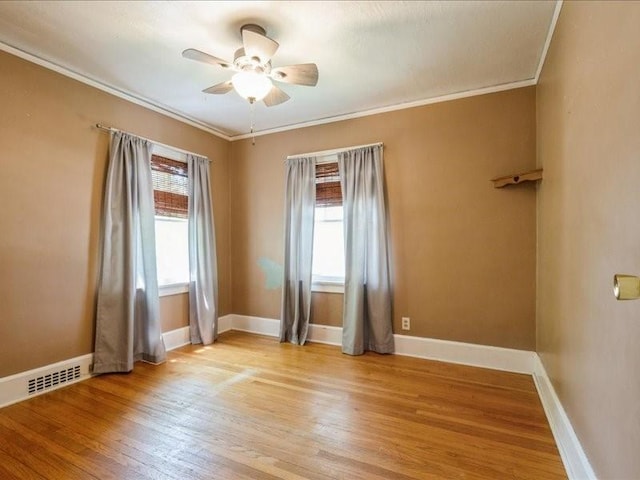 425 24th NE, Cedar Rapids, IA 52402 - empty room featuring crown molding, light wood-style flooring, and a ceiling fan