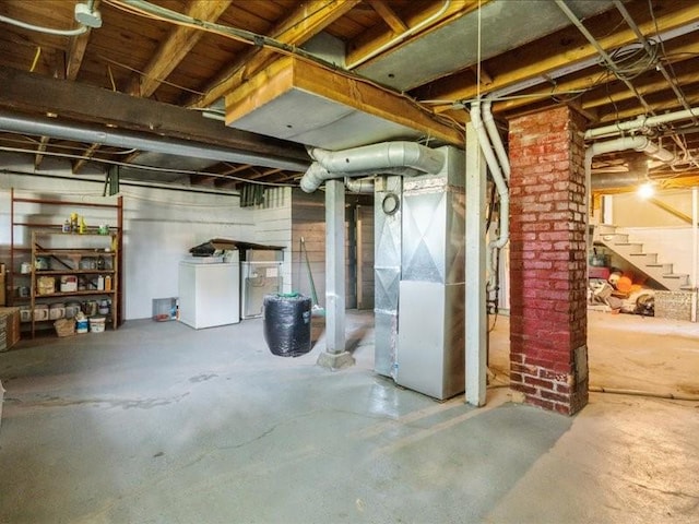 425 24th NE, Cedar Rapids, IA 52402 - unfinished basement with heating unit, stairs, and fridge
