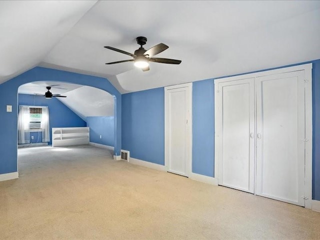 425 24th NE, Cedar Rapids, IA 52402 - bonus room featuring ceiling fan, carpet, arched walkways, and lofted ceiling
