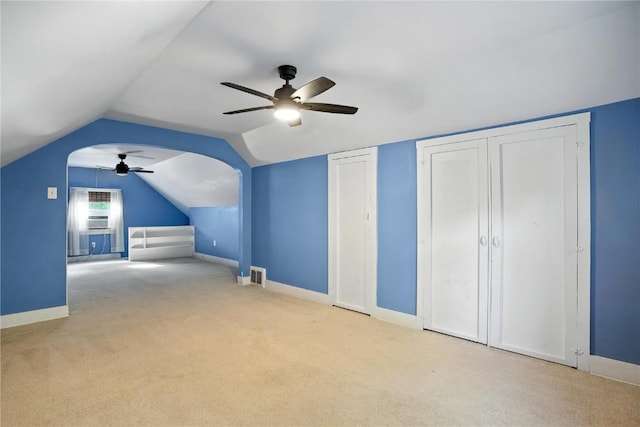 425 24th NE, Cedar Rapids, IA 52402 - additional living space with ceiling fan, carpet, and vaulted ceiling