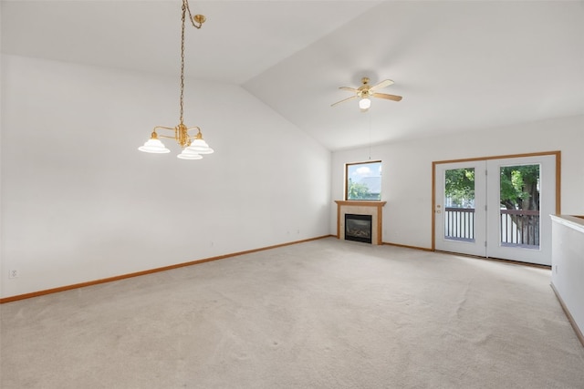 819 Winterberry Pl NE, Cedar Rapids, IA 52402 - unfurnished living room featuring healthy amount of natural light, lofted ceiling, light carpet, and a fireplace
