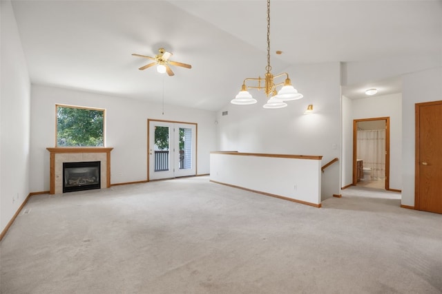 819 Winterberry Pl NE, Cedar Rapids, IA 52402 - unfurnished living room with ceiling fan, light carpet, vaulted ceiling, and a tile fireplace