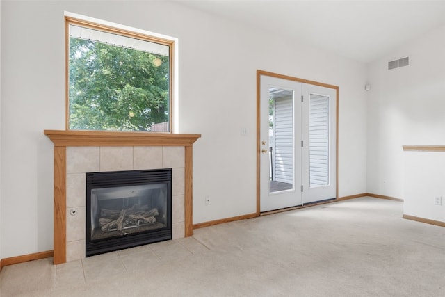 819 Winterberry Pl NE, Cedar Rapids, IA 52402 - unfurnished living room featuring carpet flooring and a tile fireplace