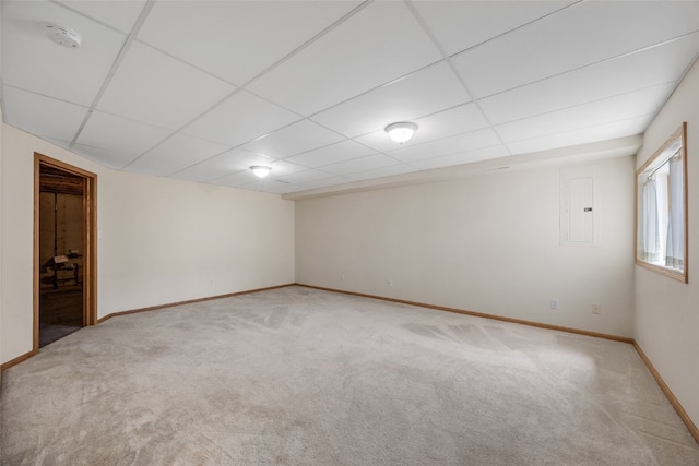 819 Winterberry Pl NE, Cedar Rapids, IA 52402 - empty room featuring carpet flooring, a paneled ceiling, electric panel, and a smoke detector