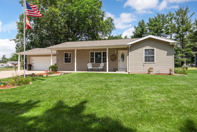 330 E S St, Lisbon, IA 52253 - single story home featuring a front yard, an attached garage, covered porch, and concrete driveway