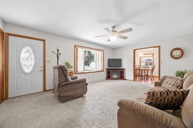 330 E S St, Lisbon, IA 52253 - living area featuring a ceiling fan and carpet flooring