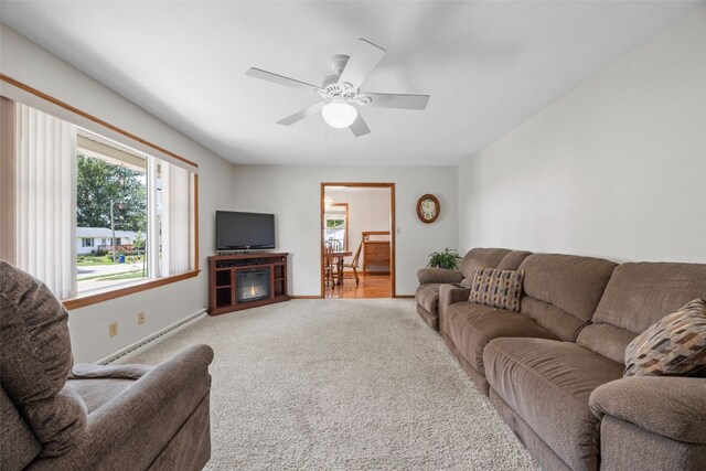 330 E S St, Lisbon, IA 52253 - carpeted living area with a baseboard heating unit and ceiling fan